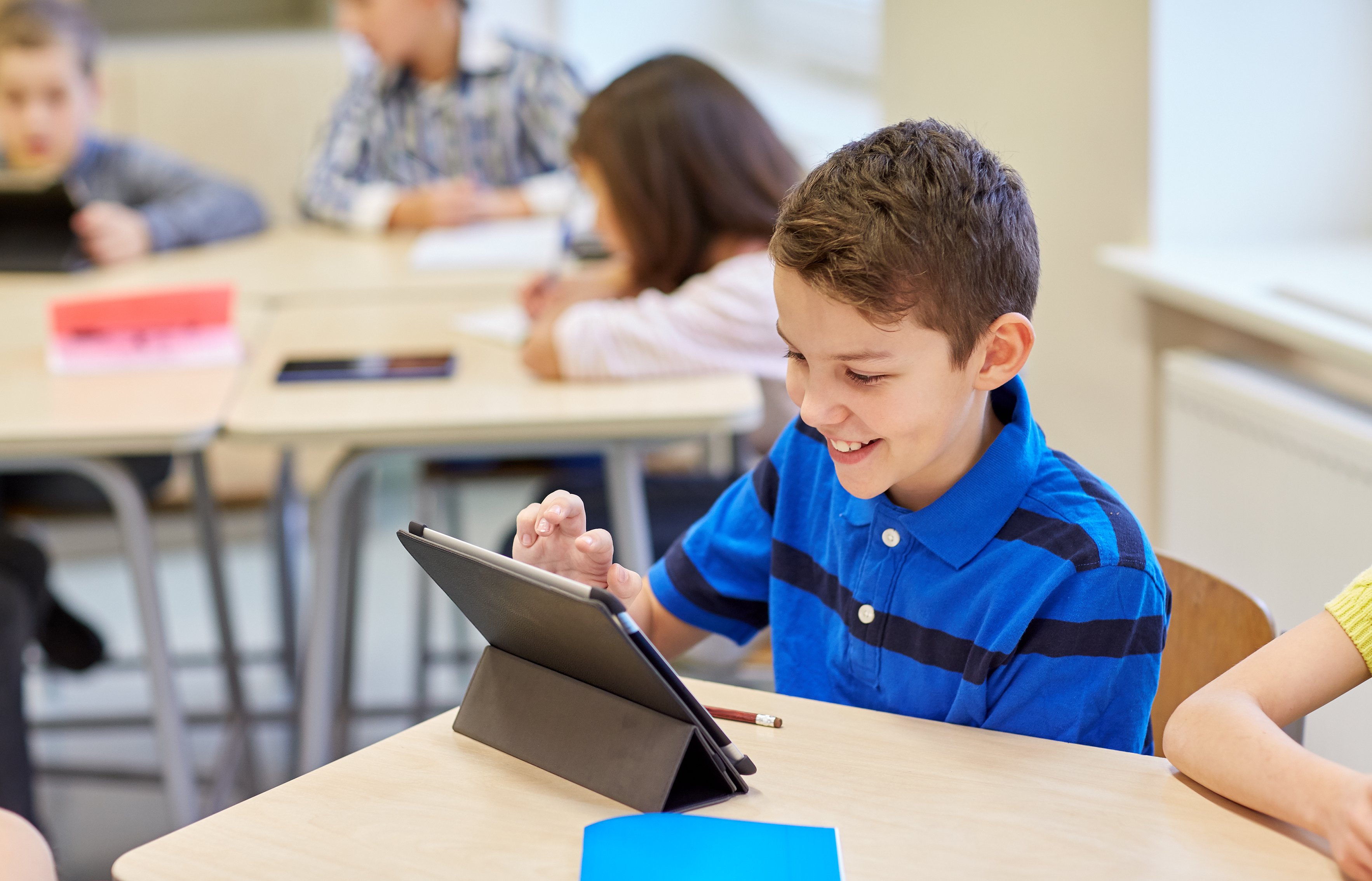 Schoolboy with computer tablet