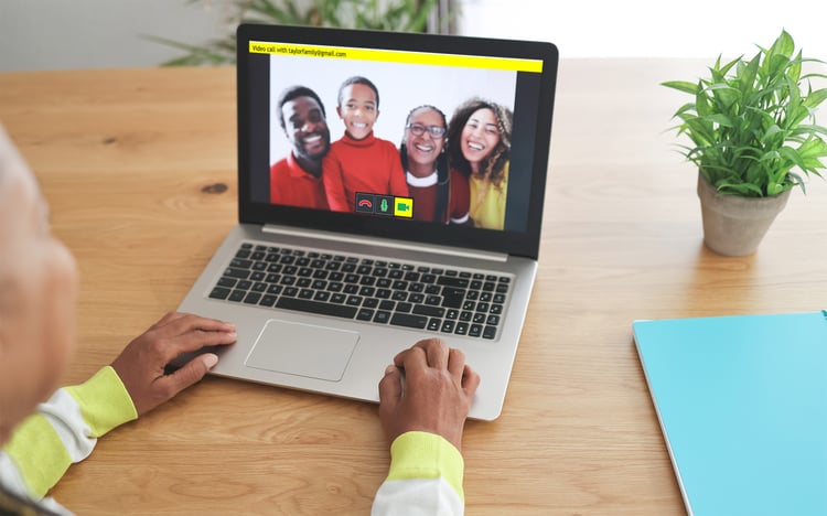 GuideConnect user Video Calls their family on a laptop