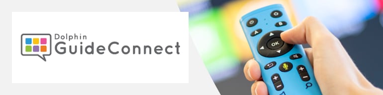 GuideConnect remote control in front of a GuideConnect screen