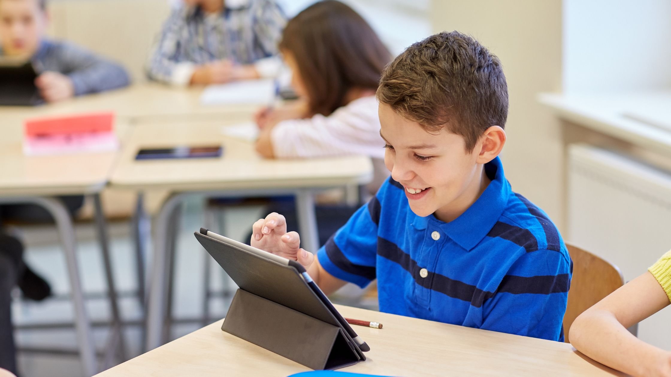 School child using tablet in class